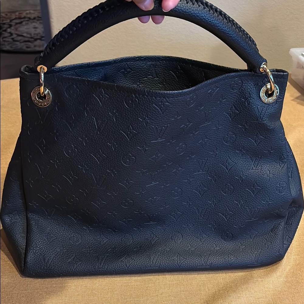 Black Pebbled Leather Shoulder Bag with Silver Hardware this is a Faux bag